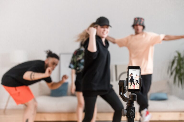 People Dancing in Front of a Smartphone